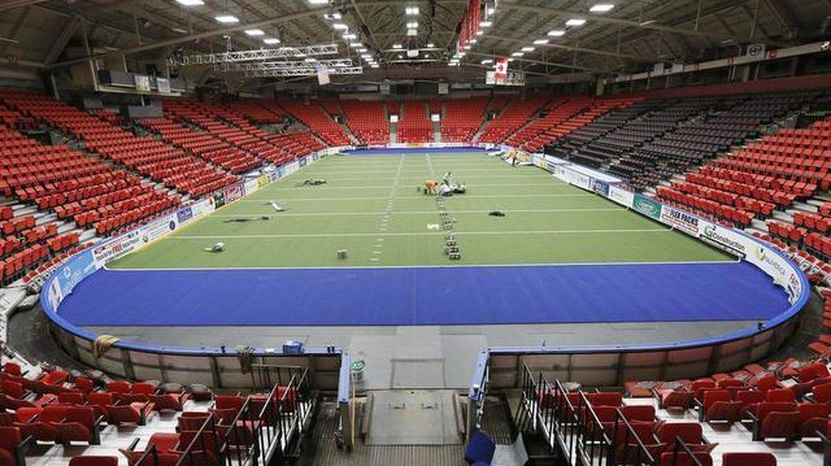 Workers from R.S. Global from Farmers Branch, Texas install new Astroturf Monday at the Toyota Center in Kennewick for the Tri-Cities Fever arena football team.