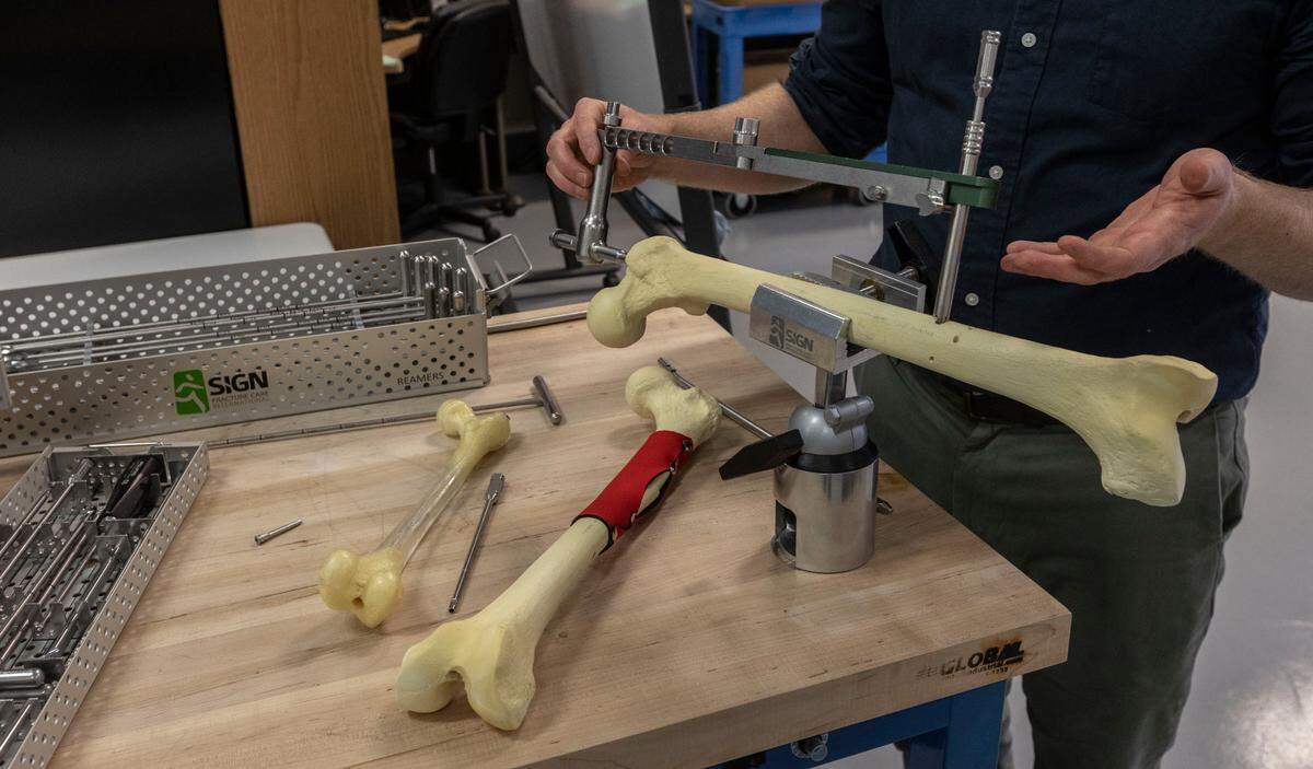 Ryan Smith, a communications specialist with SIGN Fracture Care in Richland, shows examples of medical equipment that the Tri-Cities nonprofit has sent to help surgeons in war-torn Ukraine. 