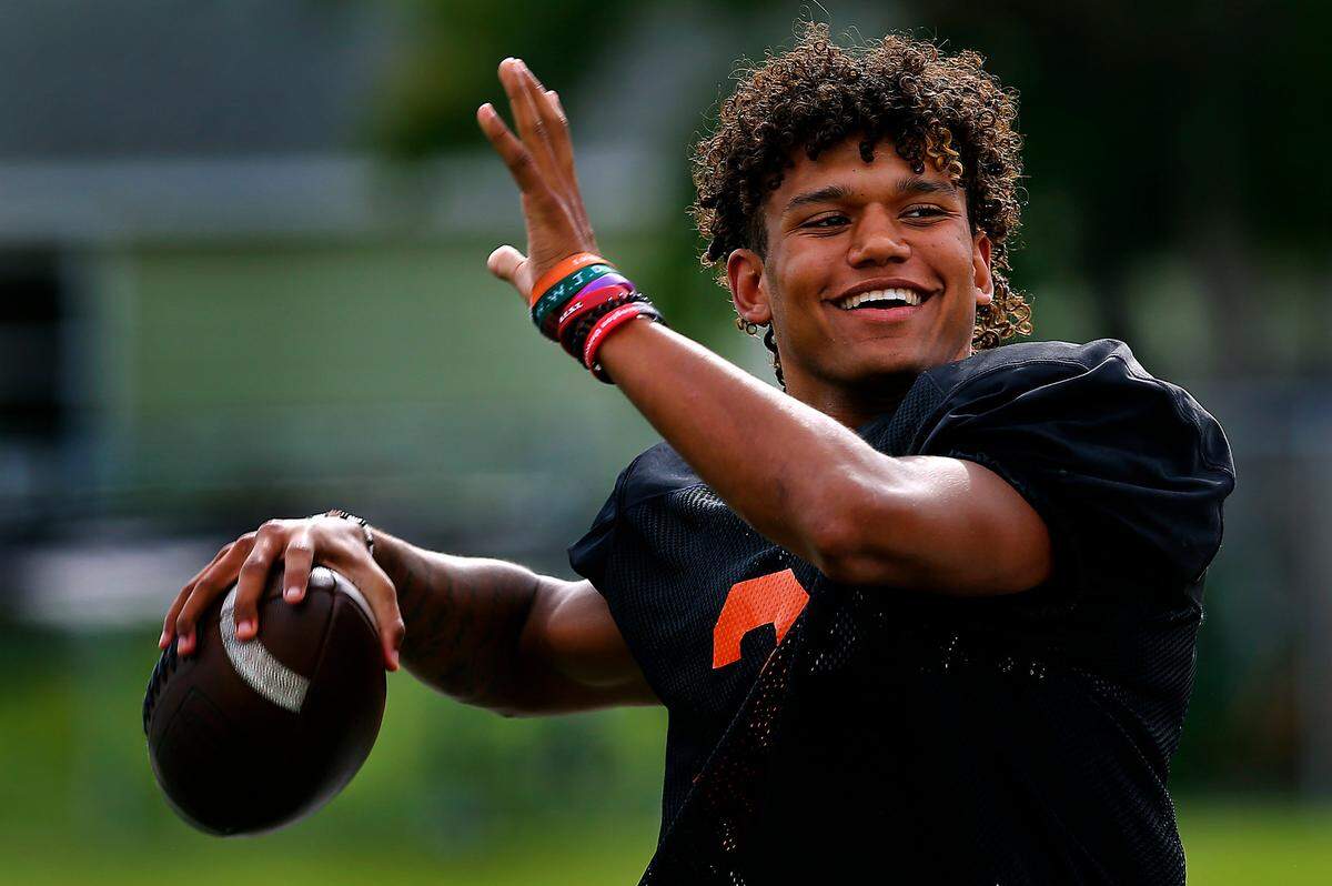 Kennewick High School quarterback Andre Breedlove warms up his throwing arm during a recent practice.