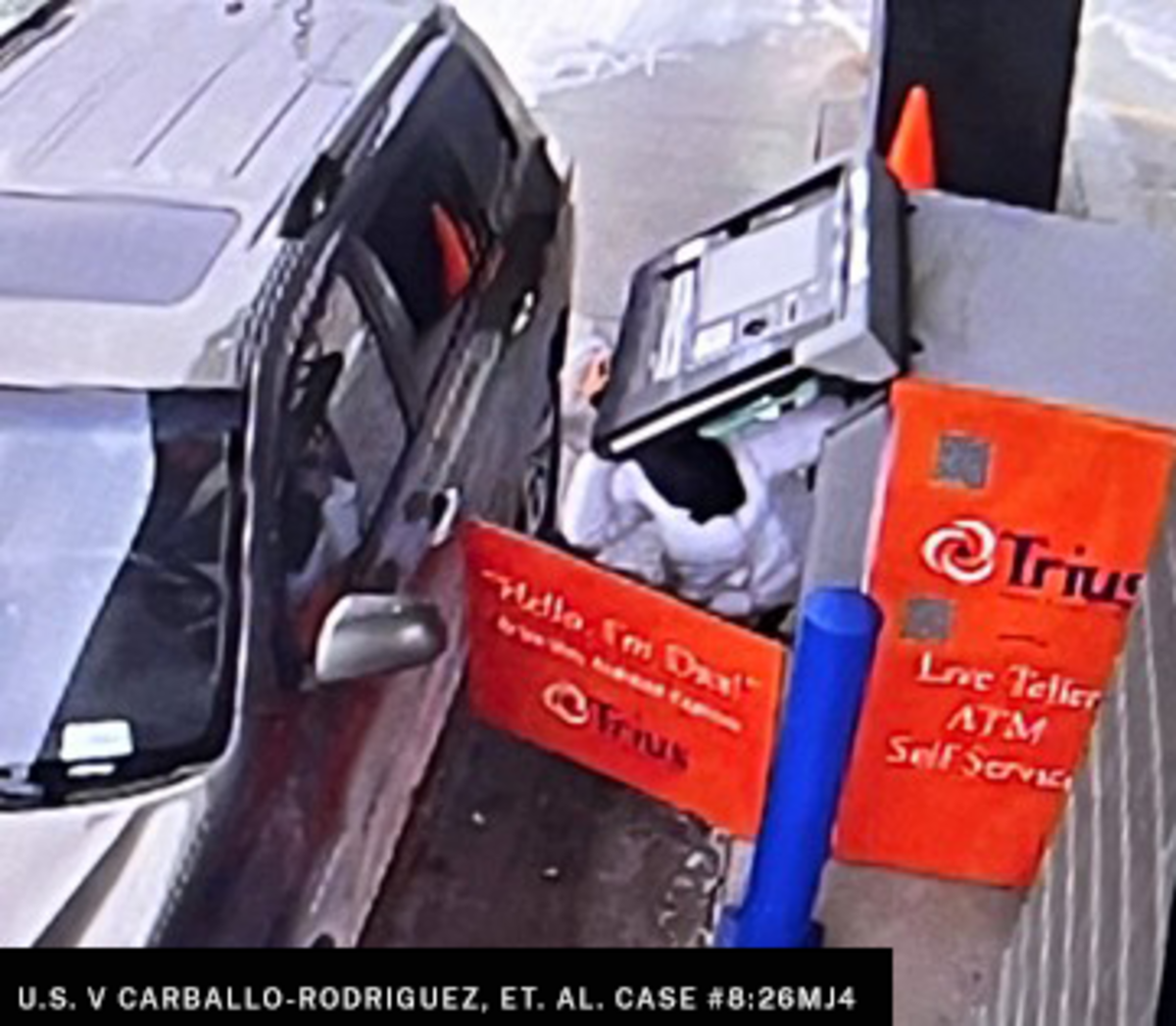 An alleged ATM jackpotting attack in progress.