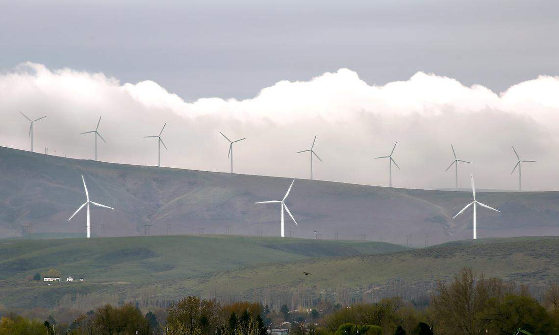 A bank of clouds slide behind wind turbines on Energy Northwest’s Nine Canyon Wind Project south of Kennewick.