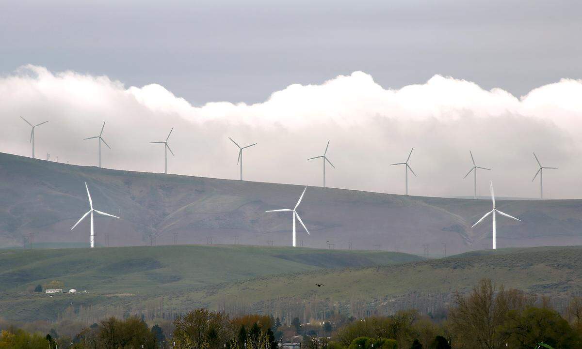 A bank of clouds slide behind wind turbines on Energy Northwest’s Nine Canyon Wind Project south of Kennewick.