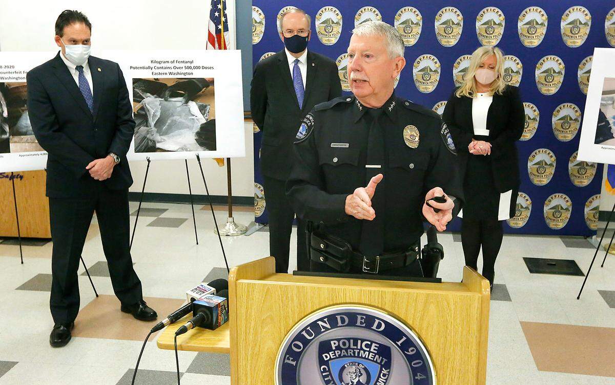 Kennewick Police Chief Ken Hohenberg speaks at Thursday’s announcement of a new Opioid/Fentanyl Outreach Initiative aimed at educating the community, especially high-school students and parents, about the dangers of illegal street drugs and prescription drug abuses. From left, he is joined by: DEA Special Agent in Charge Keith Weis, U.S. Attorney Bill Hyslop and Kennewick School Superintendent Traci Pierce.