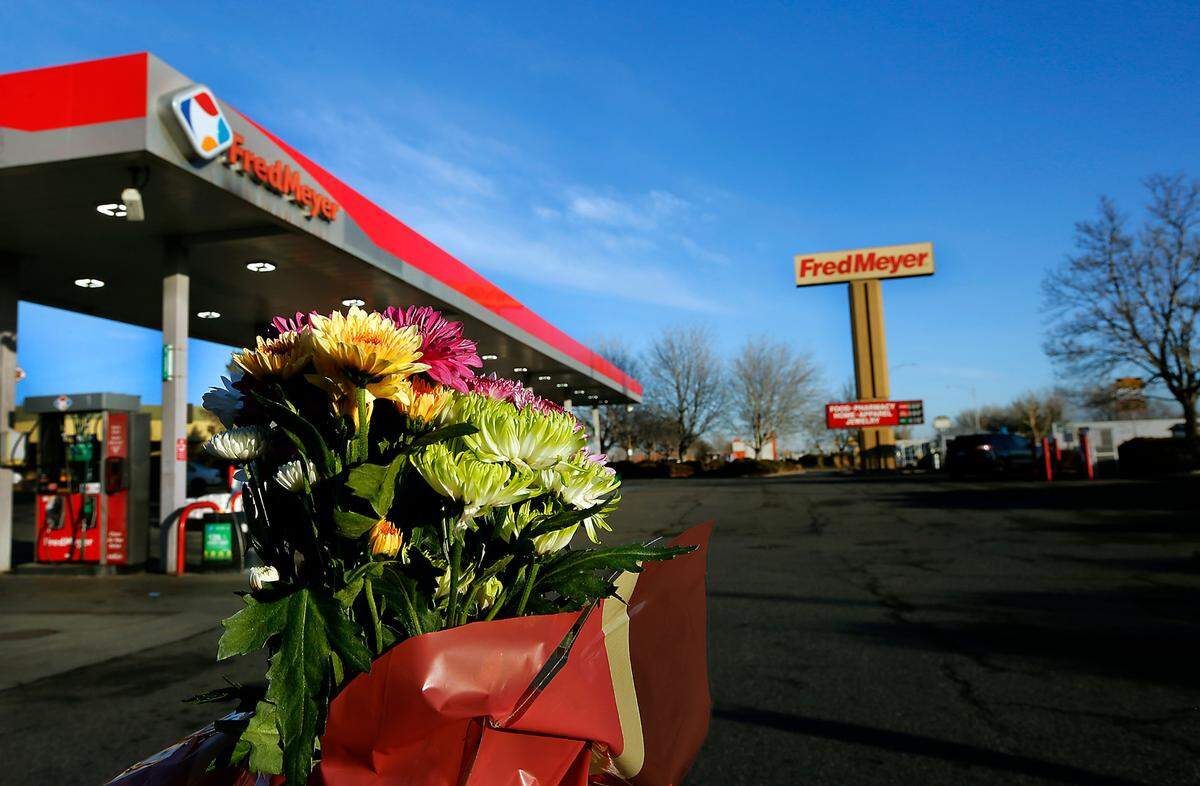 A colorful bouquet of flowers pay tribute to the victims of Monday’s shooting that took place inside the Fred Meyer store on Wellsian Way. A memorial for victim Justin Krumbah is planned at 3 p.m. Thursday in the Richland store’s parking lot.