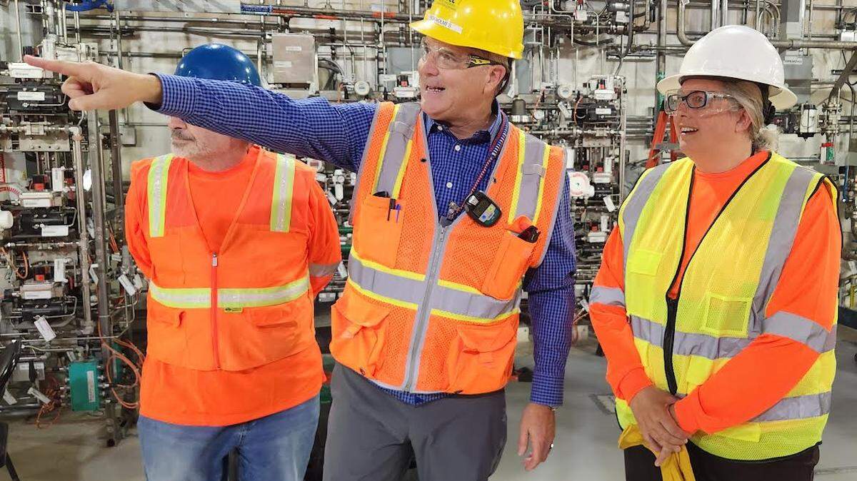 Candice Robertson, Department of Energy senior adviser for environmental management, tours the Low Activity Waste Facility at the Hanford vitrification plant near Richland, Wash., with Bechtel vice president Rick Holmes.