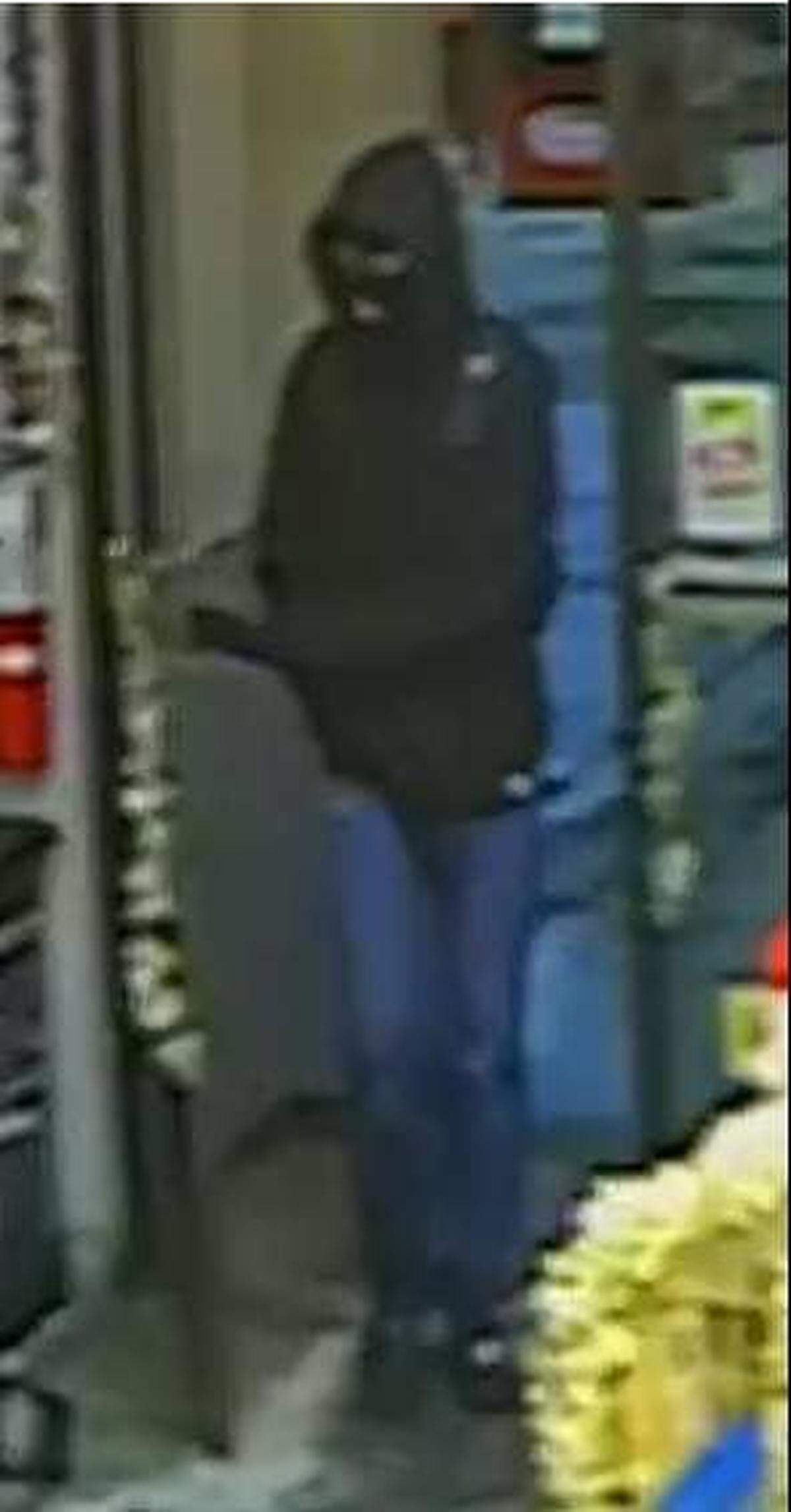 Richland police are searching for this masked man who threatened a clerk with a gun before running from a Stevens Drive convenience store.