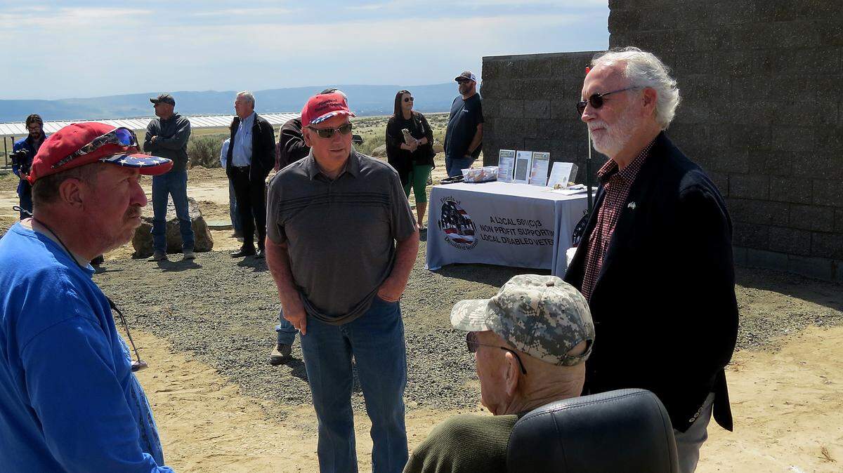 Congressman Dan Newhouse, right, attends a ribbon-cutting ceremony at the 140-acre veterans ranch being built by the Tri-Cities nonprofit Friends of Disabled Veterans.