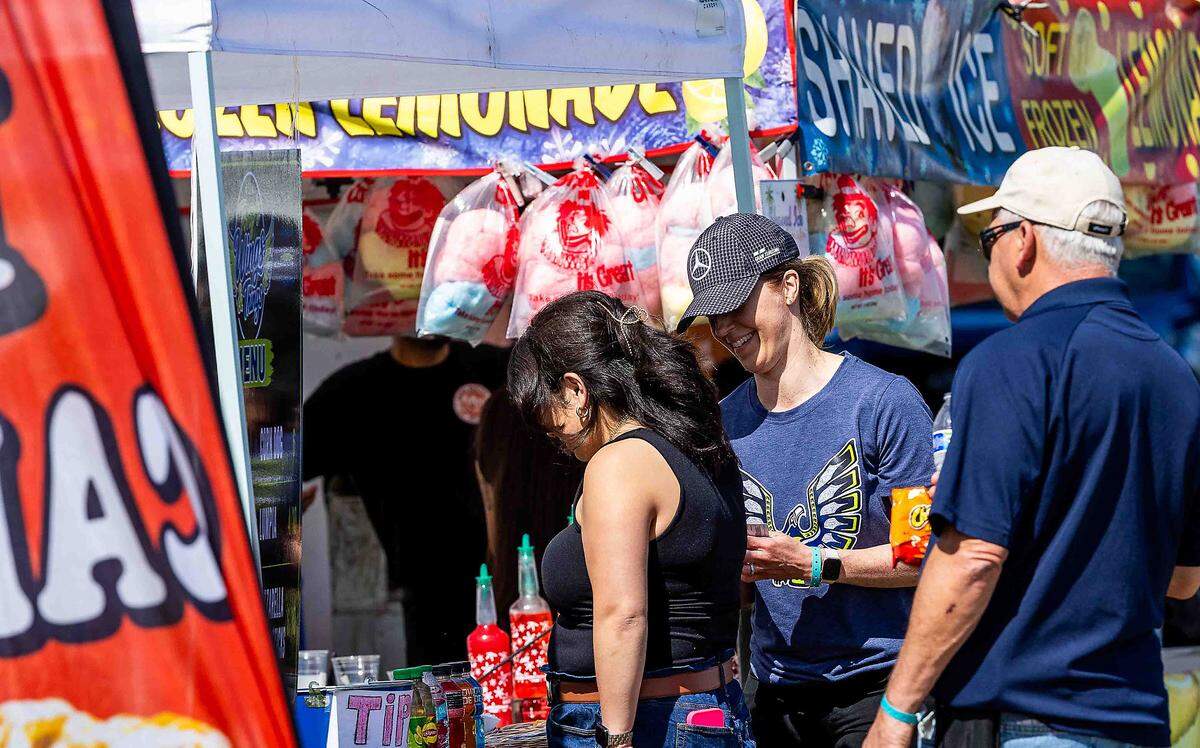 Visitors browse food and beverage vendors during H1 Unlimited spring testing at Columbia Park on Saturday in Kennewick. Water Follies officials expect more than 40,000 spectators to attend race weekend in July, generating an estimated $2.8 million in visitor spending throughout the Tri-Cities.