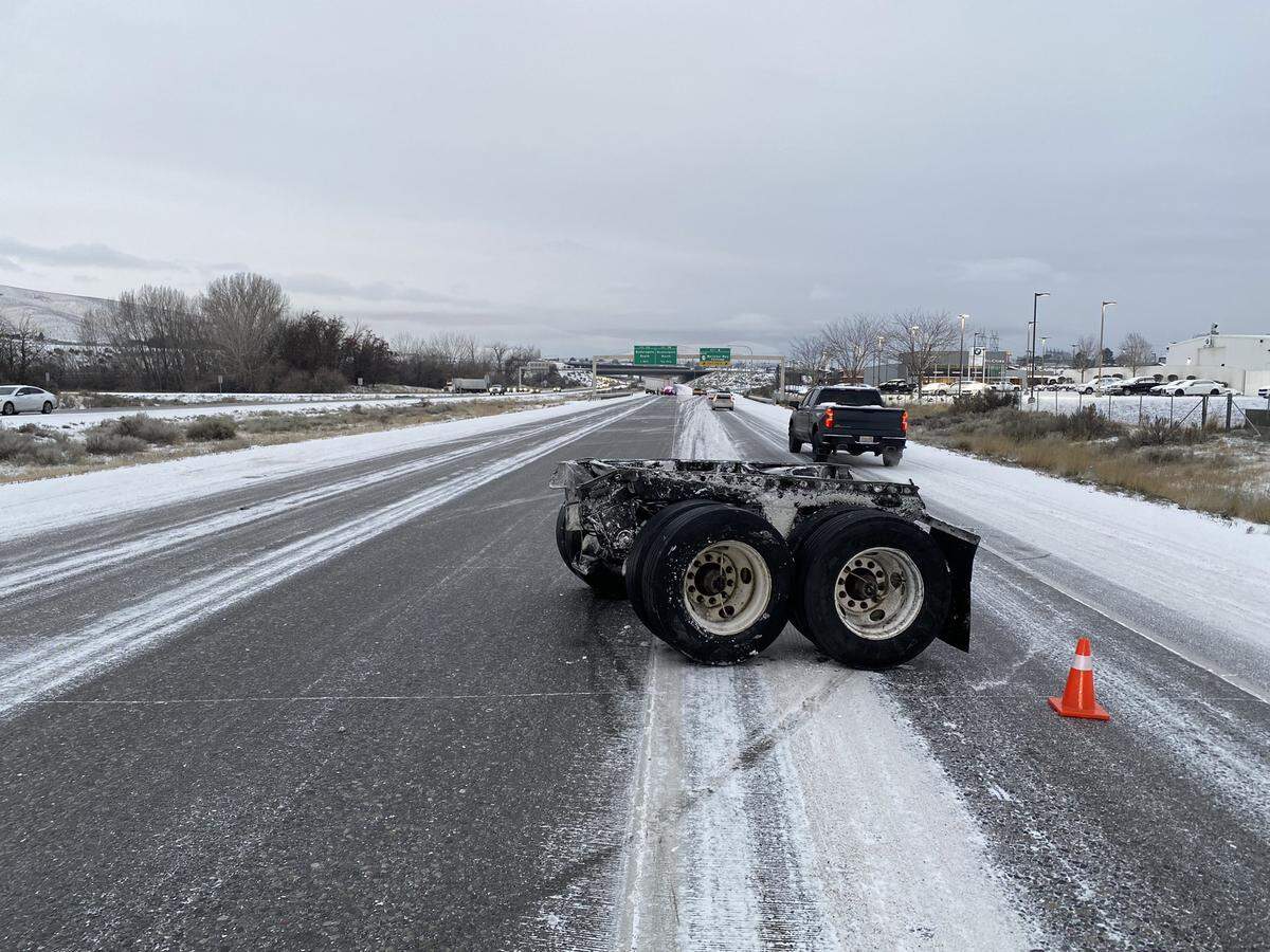 A semi truck’s trailer lost its rear axles after being hit Thursday morning by a car in the westbound lanes of Interstate 182 in Richland.