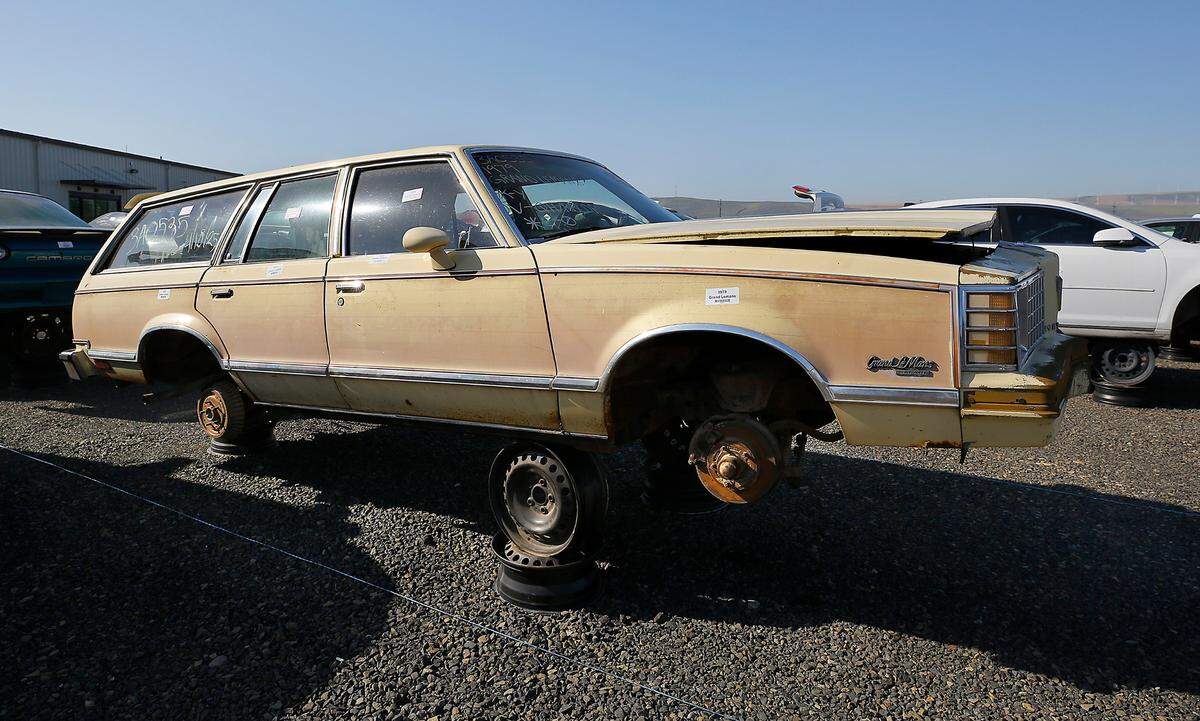 A 1979 Pontiac Grand LeMans stationwagon sit outside the new location of U-Pull-It and Supreme Truck and Auto Parts in Finley.