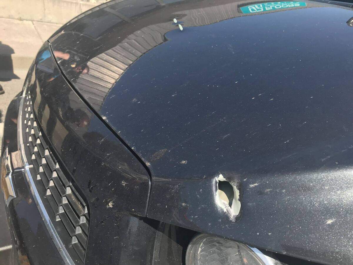 Kennewick police took this photo April 26, 2018, of a Chevy Sonic with a bullet hole in the hood after a shooting at the Clearwater Bay Apartments in Kennewick.