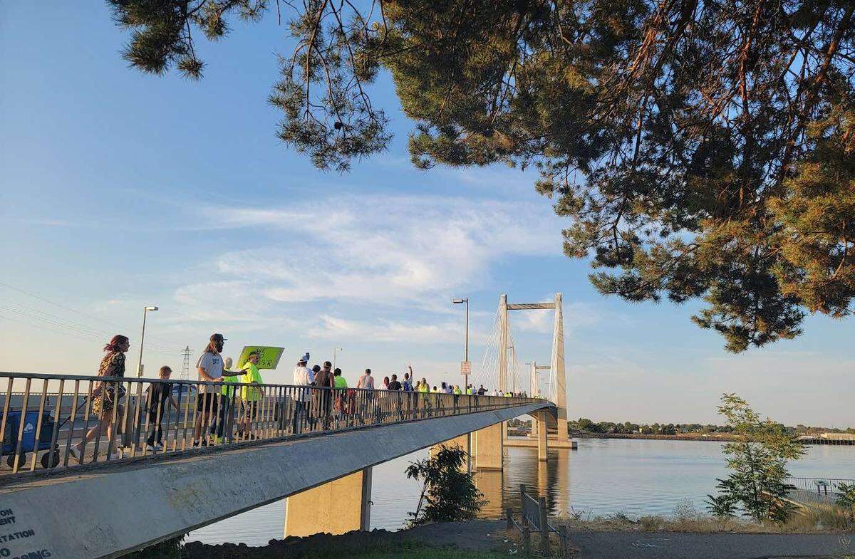 Participants line up across the cable bridge between Kennewick and Pasco during the inaugural Hands Across the Bridge Tri-Cities event in 2023.