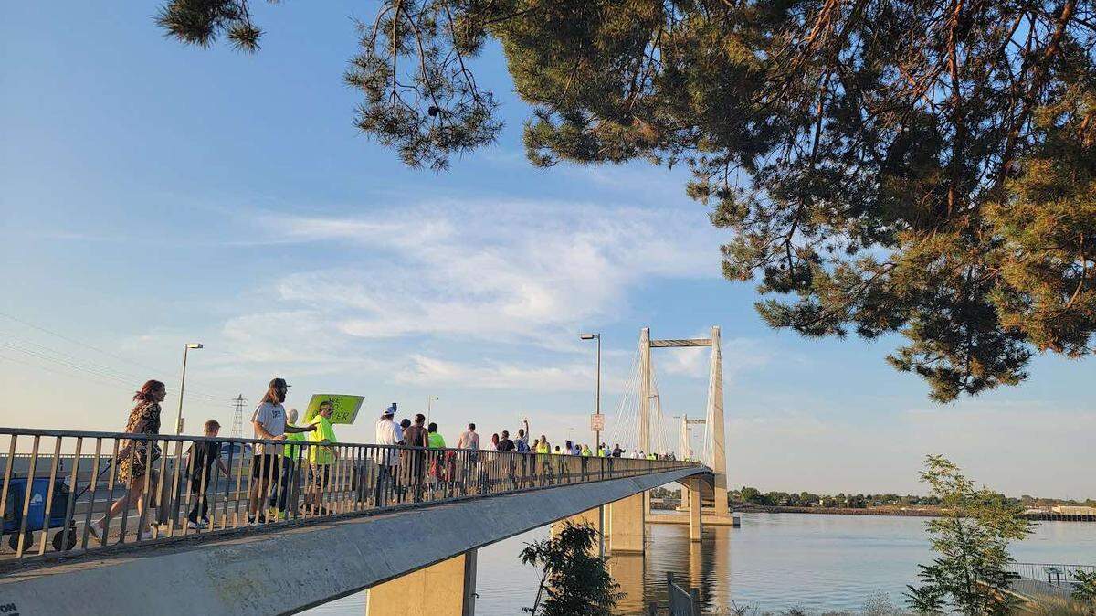 Participants line up across the cable bridge between Kennewick and Pasco during the inaugural Hands Across the Bridge Tri-Cities event in 2023.