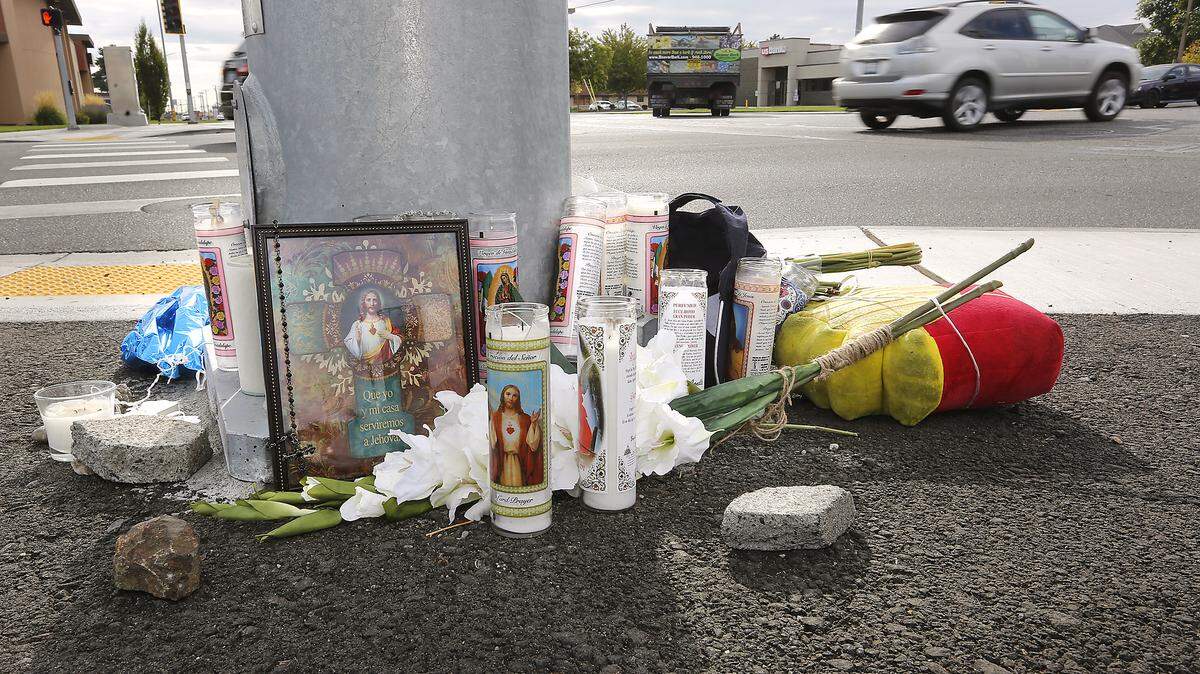 This roadside memorial of flowers, candles, balloons and a baseball hat is near where Leonel Birrueta, 31, of Kennewick, was killed on his moped at West Clearwater Avenue at Edison Street. Katie Summers, 28, is charged with DUI and hit and run from a fatal collision.