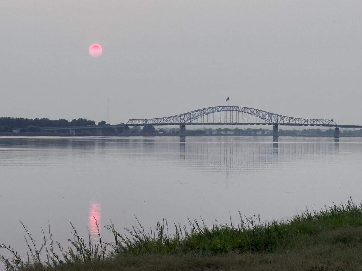 Smoky skies obscure the sunrise over the Columbia River in the Tri-Cities.