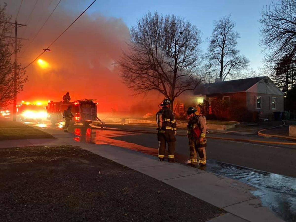 Richland firefighters work at the scene of Monday’s duplex fire on Stevens Drive.