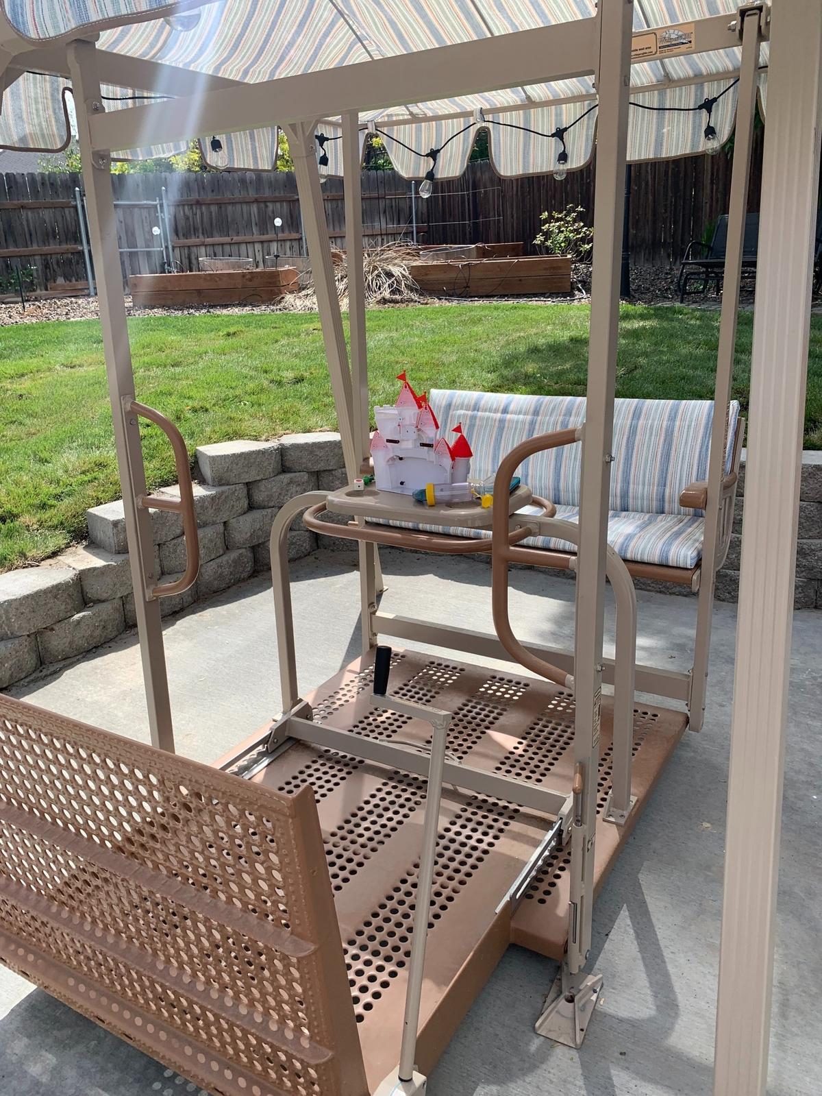In an inclusive backyard playspace put together through the Wishing Star Foundation, a swing for immobilized children waits for its first use at the backyard unveiling.