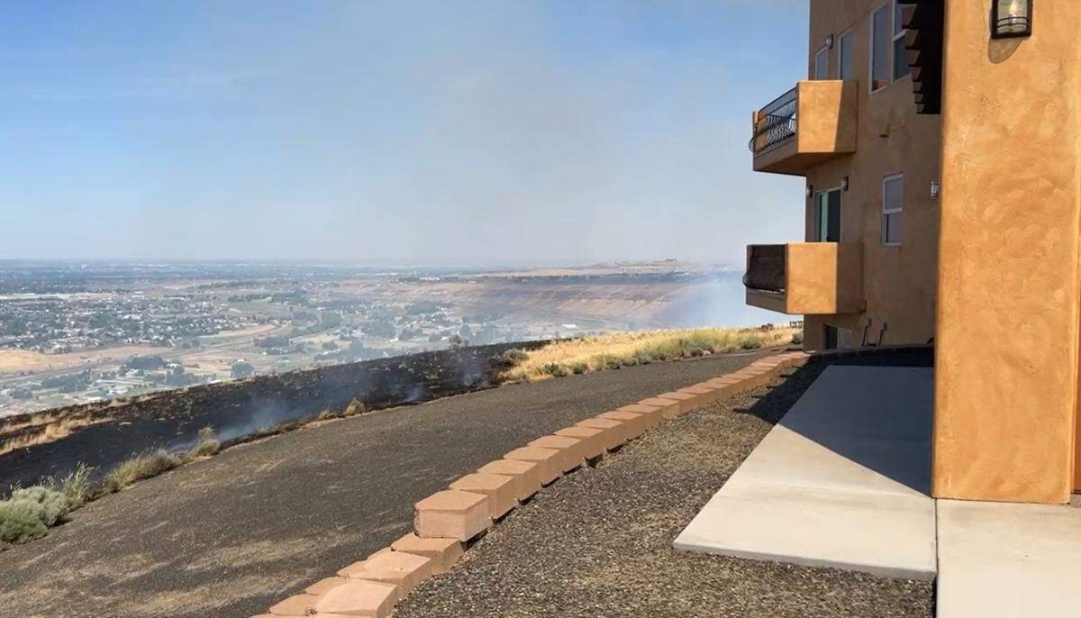 The fire burned up to the property lines of several homes on the ridge top.