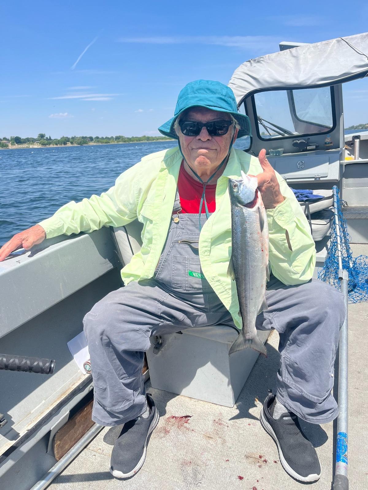 Ron Reed proudly holds up his first sockeye salmon of the summer season.