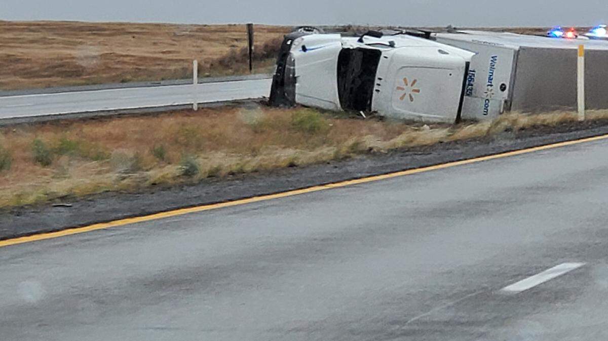 A Walmart semi truck and trailer rolled into the center median of Interstate 82 near the Oregon border. The 4:53 p.m. Saturday crash happened just up the road from the Washington State Patrol weigh station.