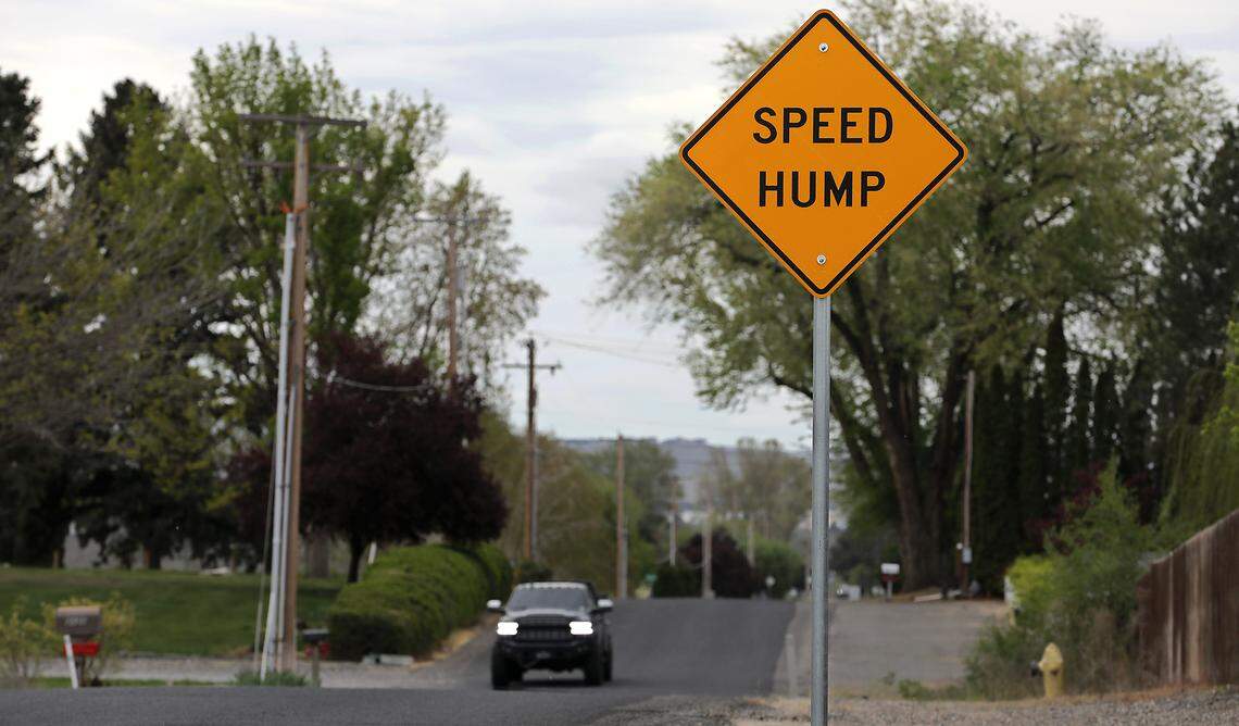 A warning sign cautions drivers about speed humps installed on North Road 96 between West Argent Road and Balfour Court in west Pasco.