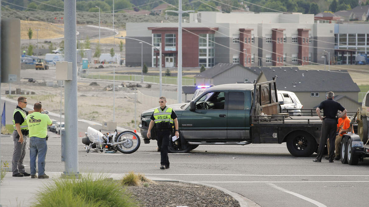 Richland police investigate a fatal motorcycle crash at the corner of Steptoe and Center Parkway in Richland on Wednesday.