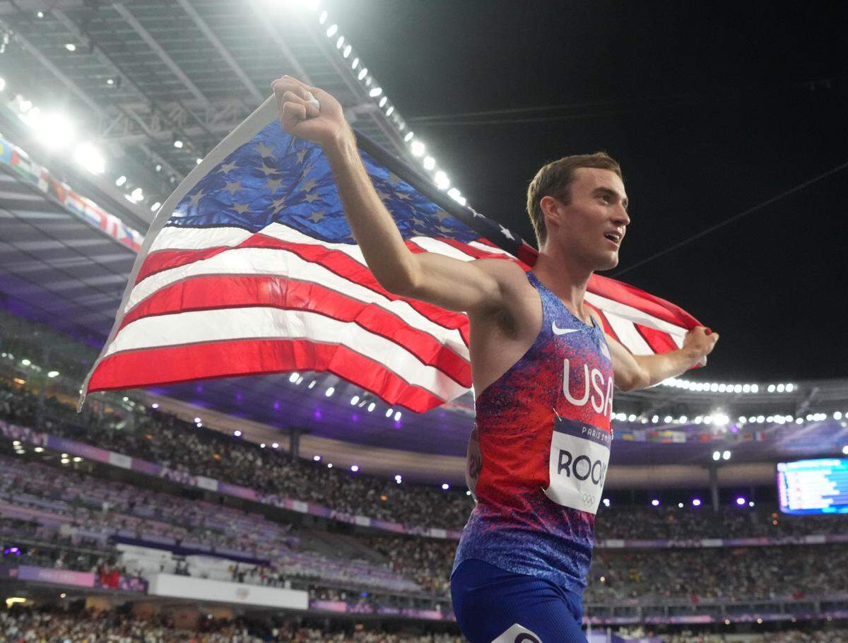 Kenneth Rooks (USA) celebrates after finishing in second place in the men's 3000m steeplechase final during the Paris 2024 Olympic Summer Games at Stade de France. Mandatory Credit: Kirby Lee-USA TODAY Sports
