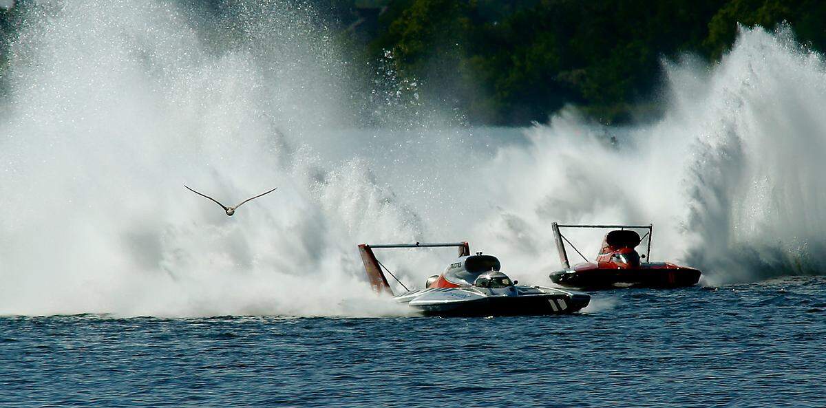 A gull flies over the Columbia River as J. Michael Kelly in the U-8 Miss Tri-Cities unlimited hydroplane races to victory in front of Andrew Tate in the U-12 Graham Trucking in Heat 2A of Columbia Cup racing action in 2021.