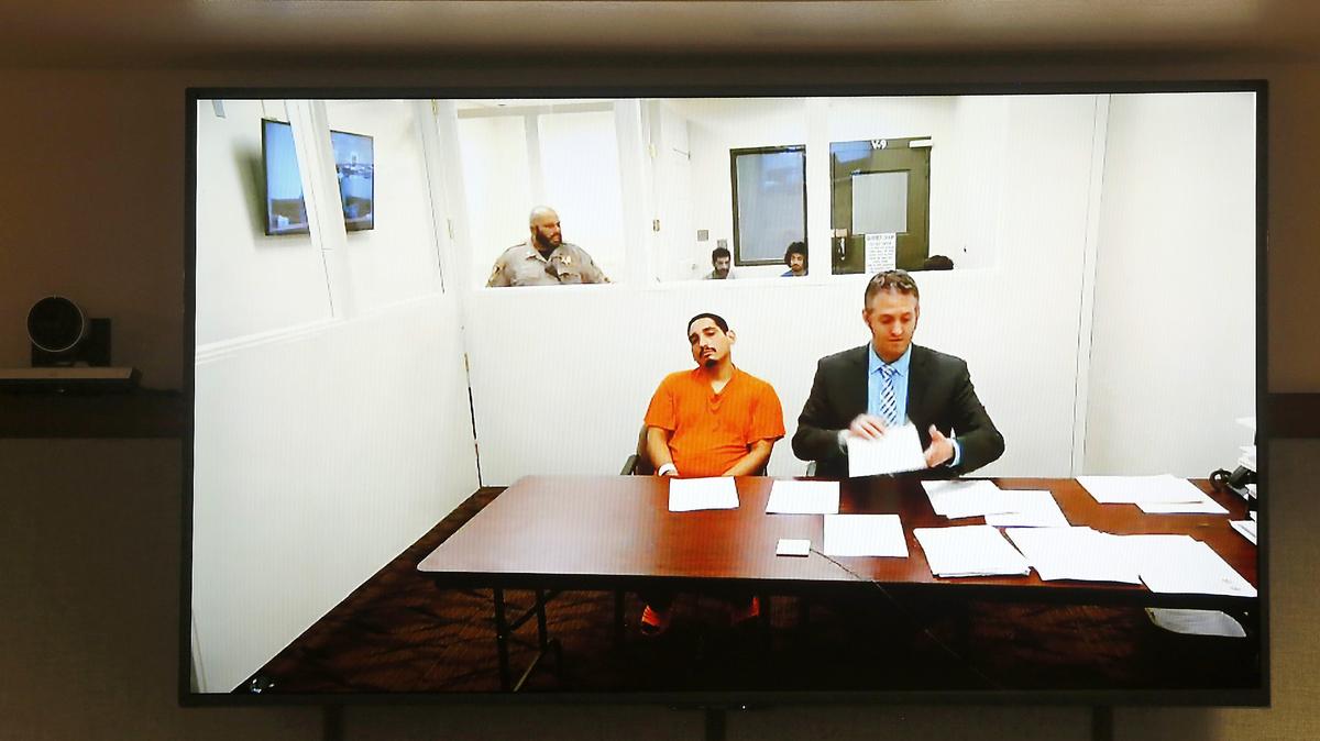 Alex Deleon, left, appears with provisional defense attorney Michael Quillen before Judge Jackie Shea Brown via a video link. He’s being held on $250,000 bail on suspicion of shooting another man in the leg at crowded Pasco nightclub over a restroom argument.
