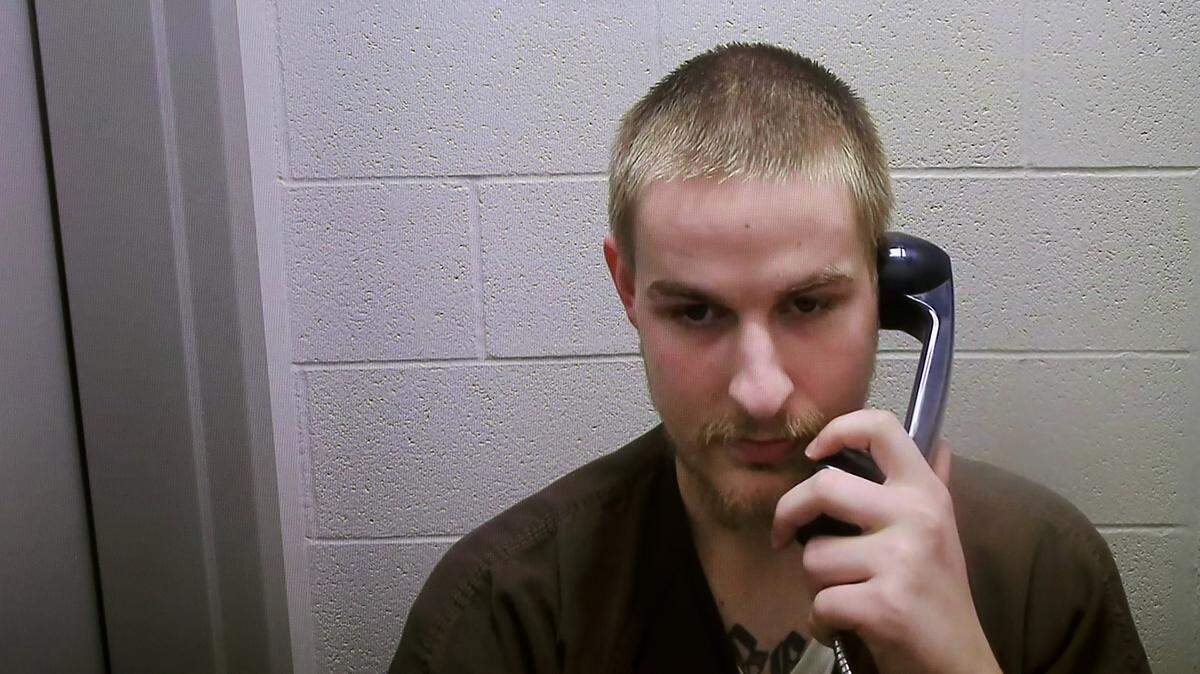 Micheal Ray Golden, 23, appears in Benton County Superior Court via a video link from the Benton County jail. He
