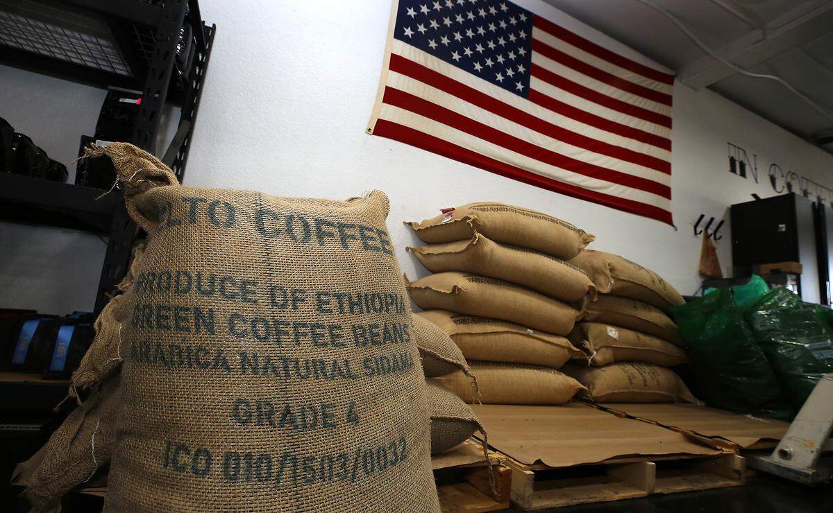 Bags of unroasted coffee beans sit on pallets at Rockabilly Roasting Co., 101 W. Kennewick Ave.