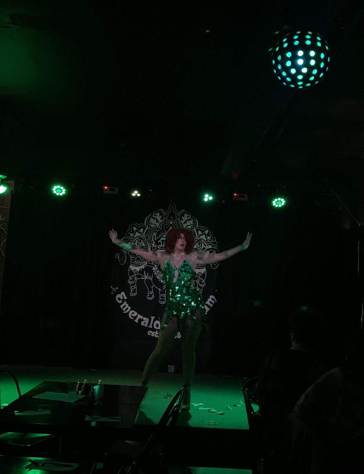 Local drag queen Manaja Twat hits a dramatic pose during a performance at the Saint Patrick’s Day Drag Show at The Emerald of Siam.