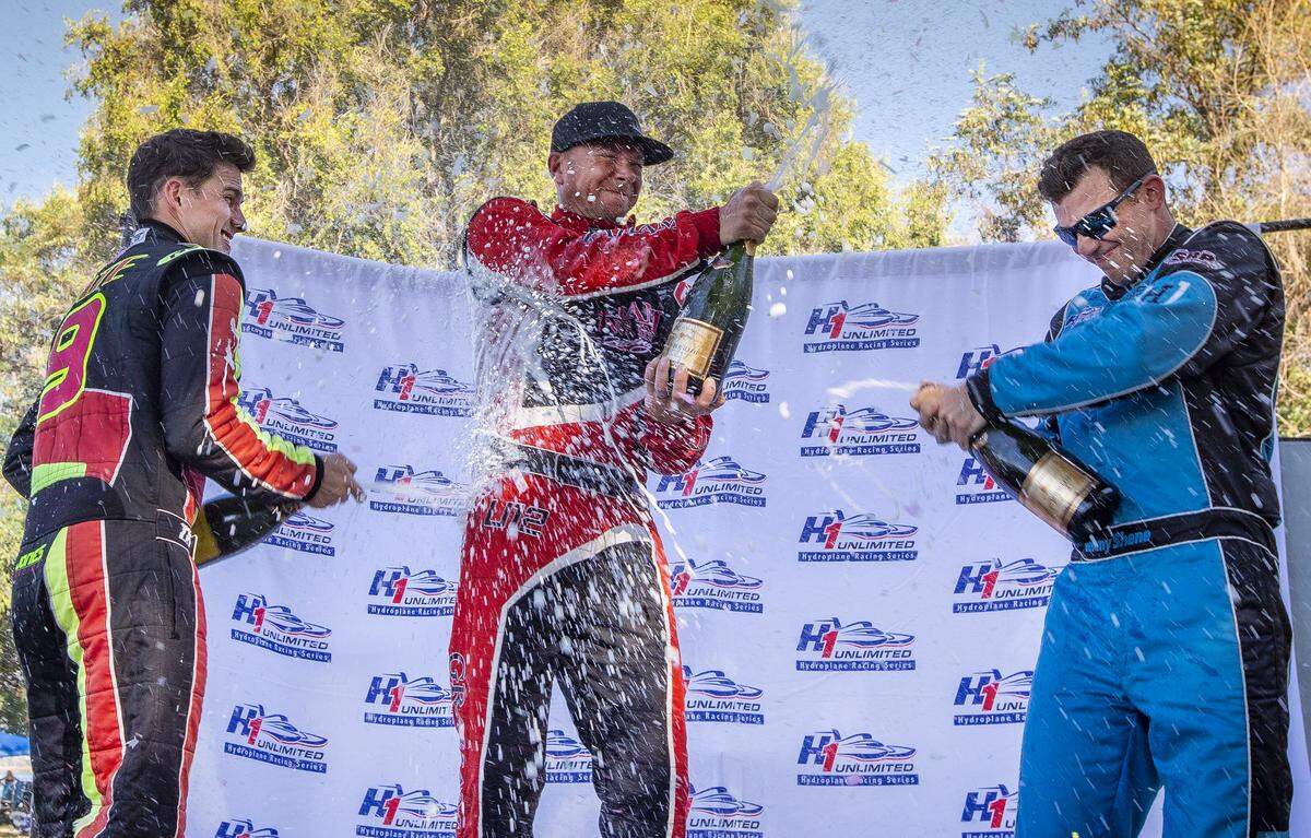 Andrew Tate, left, J. Michael Kelly, center, and Jimmy Shane celebrate their wins at the end of the HAPO Columbia Cup on Sunday wrapping up Water Follies at Columbia Park in Kennewick. Kelly won the Columbia Cup, Tate took second and Shane took third.