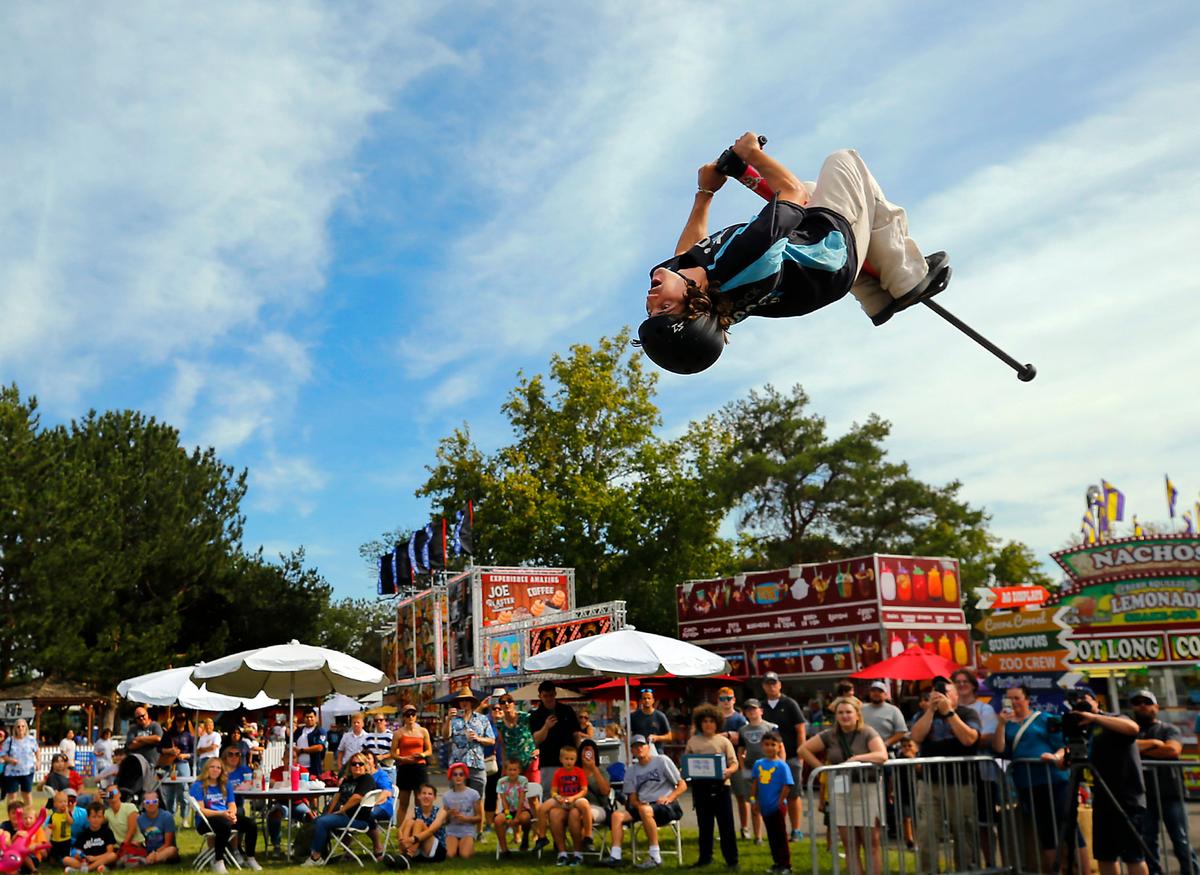 Henry Cabelus, a member of the XPogo Stunt Team, works on his final trick, a series of consecutive backflips, during Wednesday’s performance at the Benton Franklin Fair & Rodeo in Kennewick.