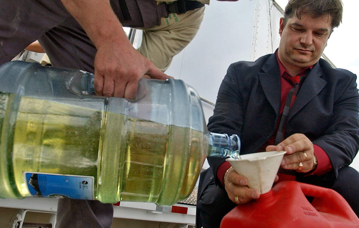 Former Green Power CEO Michael Spitzauer collects freshly-made diesel to put into his SUV during a demonstration in 2006.