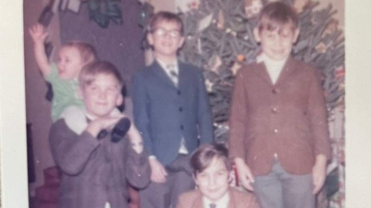 An authentic sepia photo taken at catechism over 50 years ago of Dr. Craig P. Davis and his siblings. Pictured are (Left to right) Bill, Russ, Paul, Craig, and Sarah Davis.