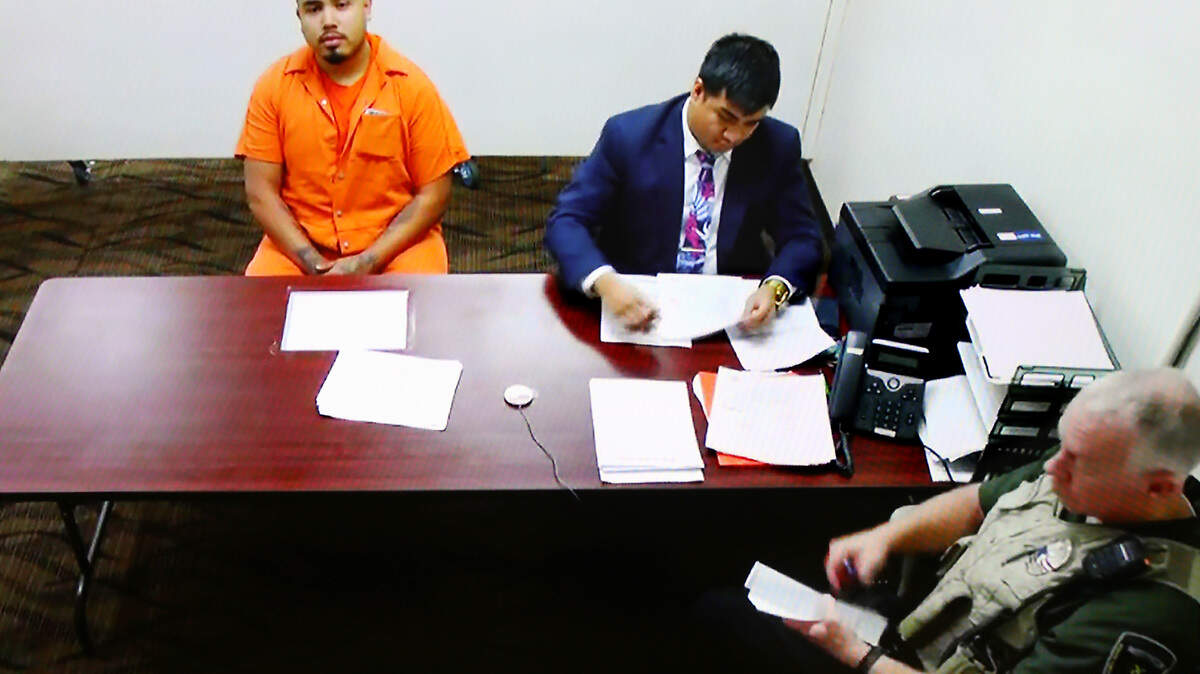Suspected shooter Osman Morales-Salto, 21, appears in Franklin County Superior Court via a video link with public defense attorney Michael Anthoni Nguyen Thursday in Pasco. He is one of two men accused of shooting six people when they opened fire at a Pasco party last weekend.