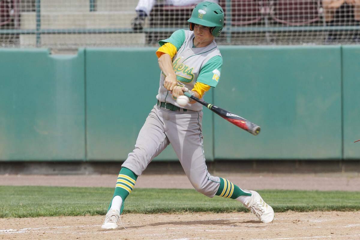 Richland’s Taylor Johnson swings the bat during a 4A state semifinal against Federal Way on Friday. Richland won 11-0.