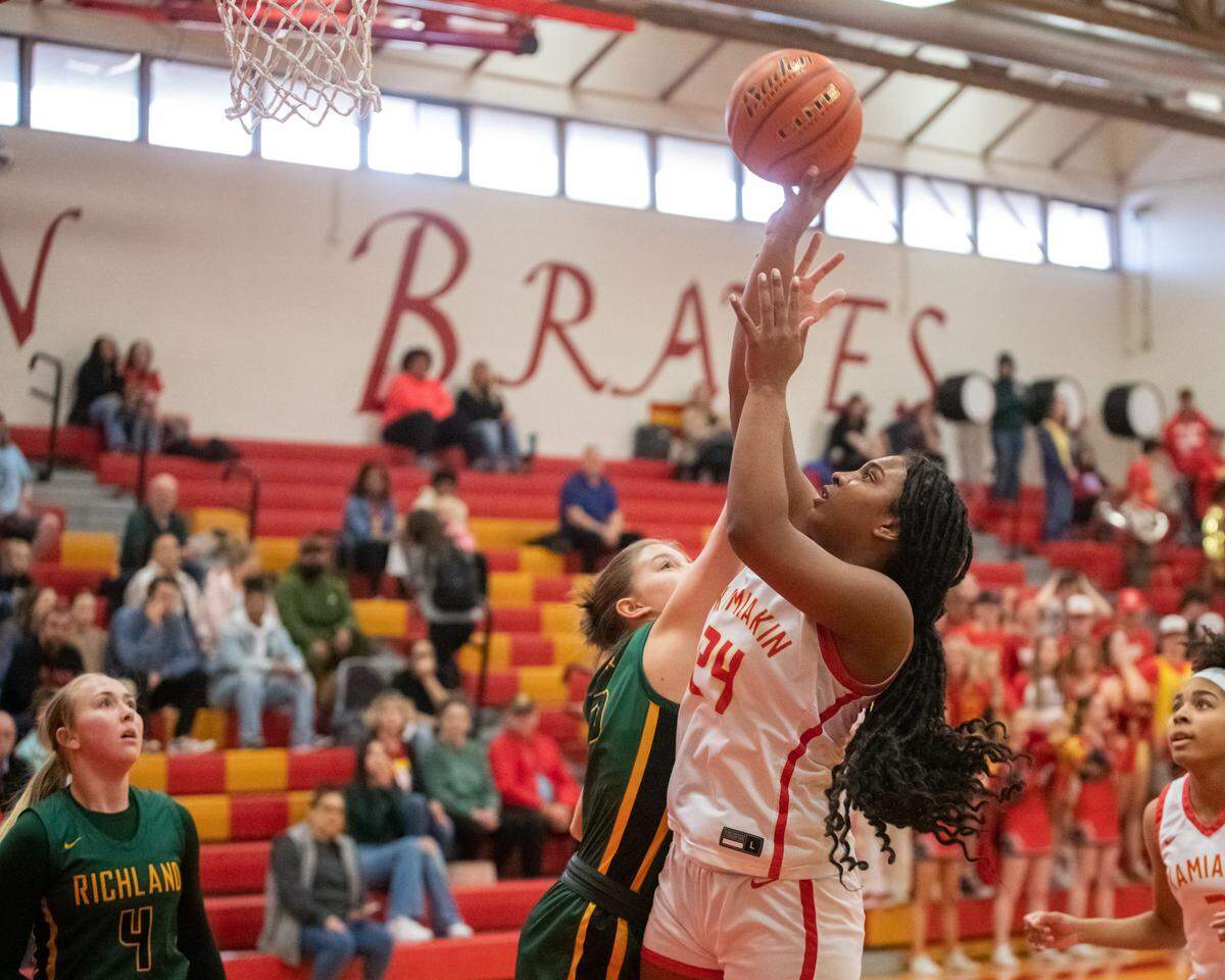 Kamiakin’s Mia Howard (24), seen here against the Richland Bombers, scored 16 points Friday in the Braves loss to Camas. They play in Tacoma on Wednesday.