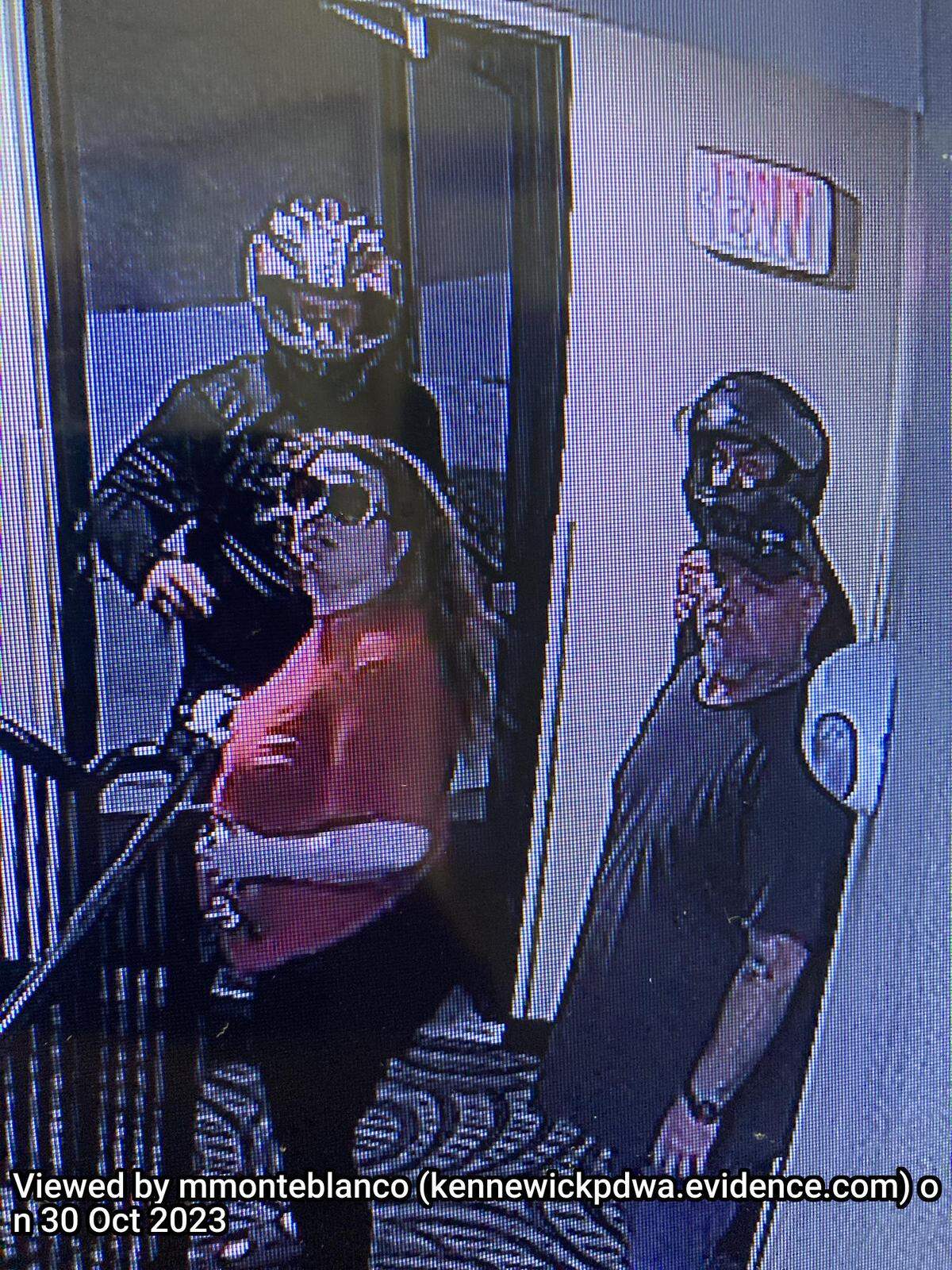 Kennewick police are asking for help identifying the people in this picture, which includes people who forced their way into a hotel room.