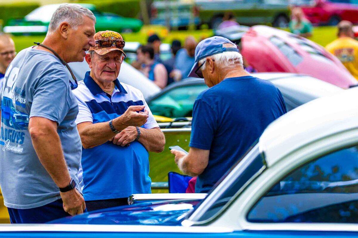 Visitors gather to admire classic cars Saturday during the Show N Shine at Cool Desert Nights in Richland. The annual event drew car enthusiasts and community members to the Uptown Shopping Center for a weekend celebrating classic automobiles and local traditions.