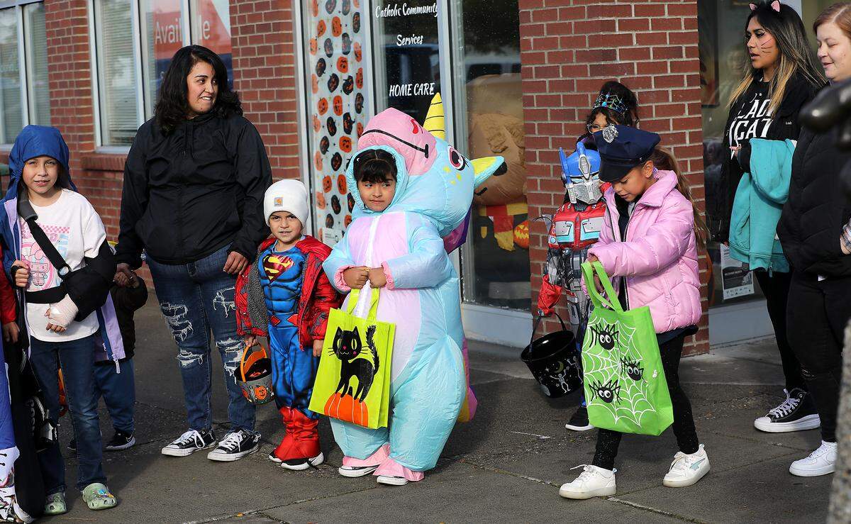 Hundreds of trick-or-treaters take part in the annual Downtown Kennewick Halloween Boo Bash. Business owners open their doors and hand out treats to the crowds that line up on Kennewick Avenue.