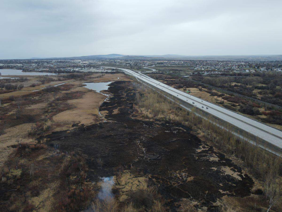 A fire is continuing to burn in the Yakima River delta after starting early Sunday in a marshy area.