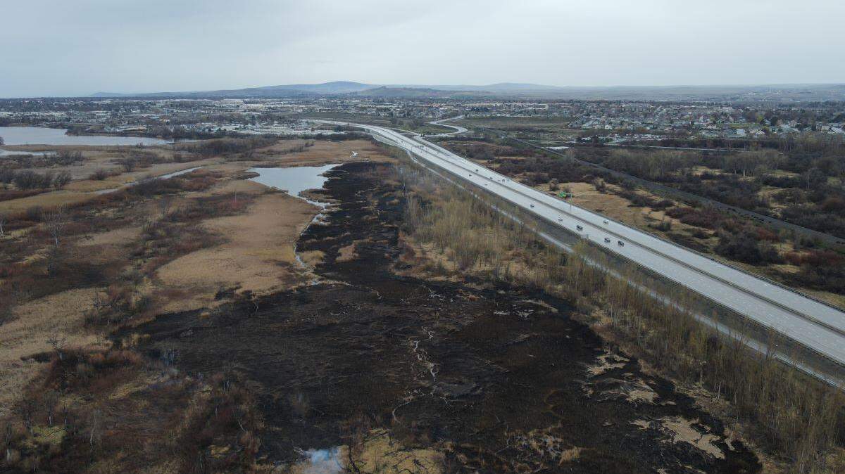 A fire is continuing to burn in the Yakima River delta after starting early Sunday in a marshy area.