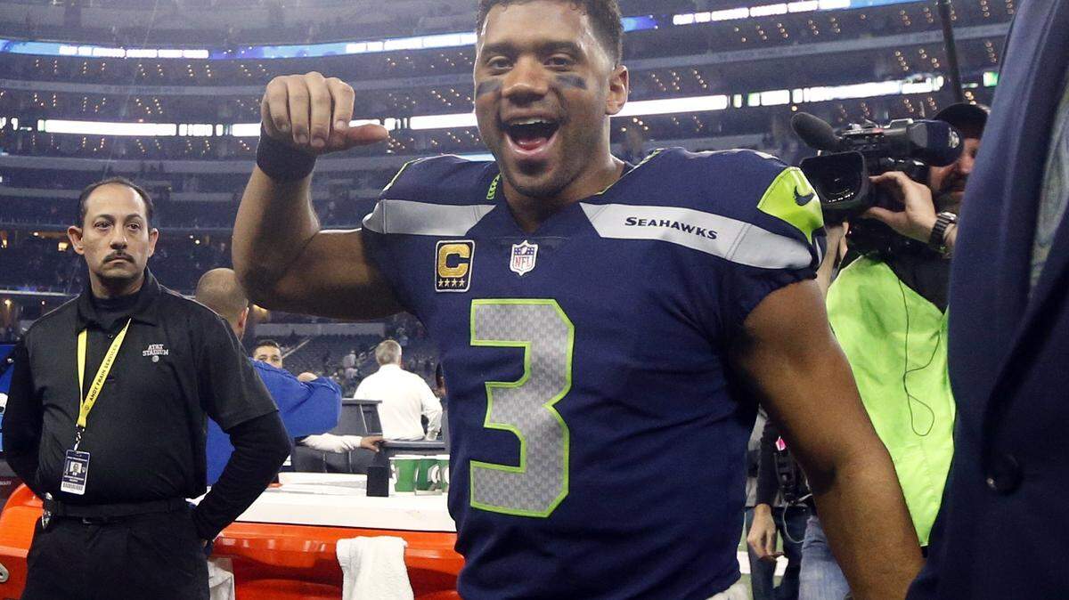 The Tri-City Chamber of Commerce will sell tickets for its 15th annual Tri-City Day at the Seattle Seahawks starting July 27.  Above, Seahawks’ Russell Wilson cheers as he walks off the field after their NFL football game against the Dallas Cowboys in December.