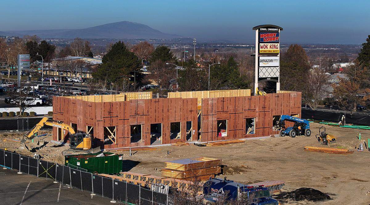 Most of the exterior wall panels are in place for the new 5,000-square-foot Chick-fil-A restaurant at 7009 W. Canal Drive in Kennewick. The new building includes a kitchen, inside seating for 70, patio seating for 24, 96 parking stalls and features a two-lane drive through. The existing parking lot has fenced off for construction of the structure. Photo taken on Jan 27, 2025.