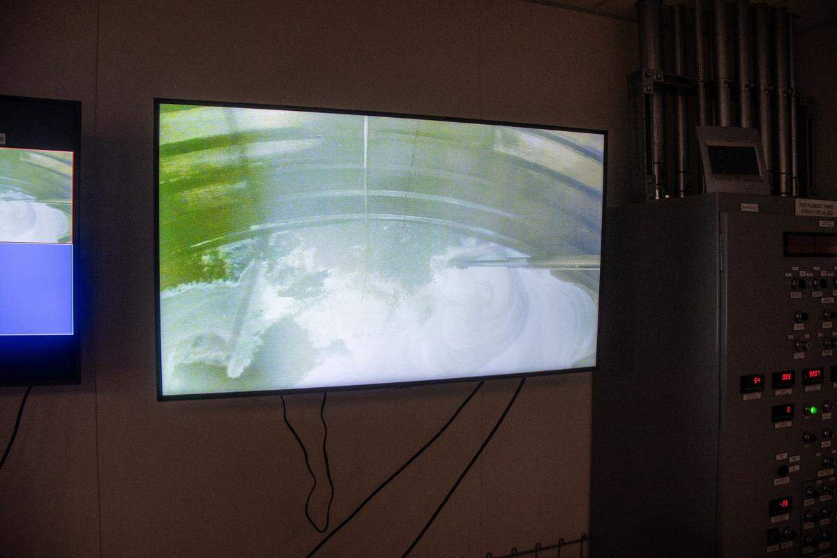 The inside of Tank A-102 is shown with a video screenshot as work is done remotely to breakup and remove radioactive salt cake from the single-shell Hanford nuclear site tank.