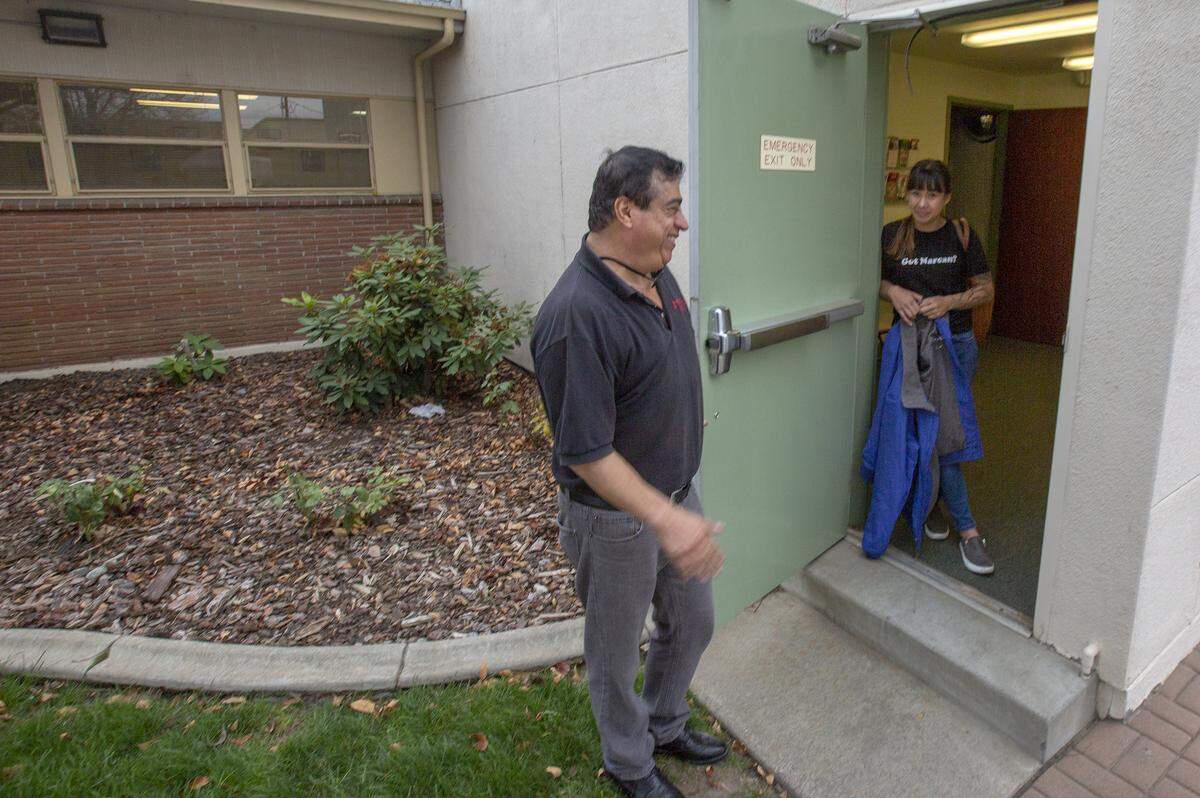 Blue Mountain Heart to Heart HIV/AIDS Support Services’ Raul Morales and Melissa Cross stand outside the entrance of the needle exchange service at 412 W. Clark St, Pasco. The entrance of the Pasco location is a discreet side door in between the Franklin County WSU extension building and the main entrance of Benton Franklin Health District building.