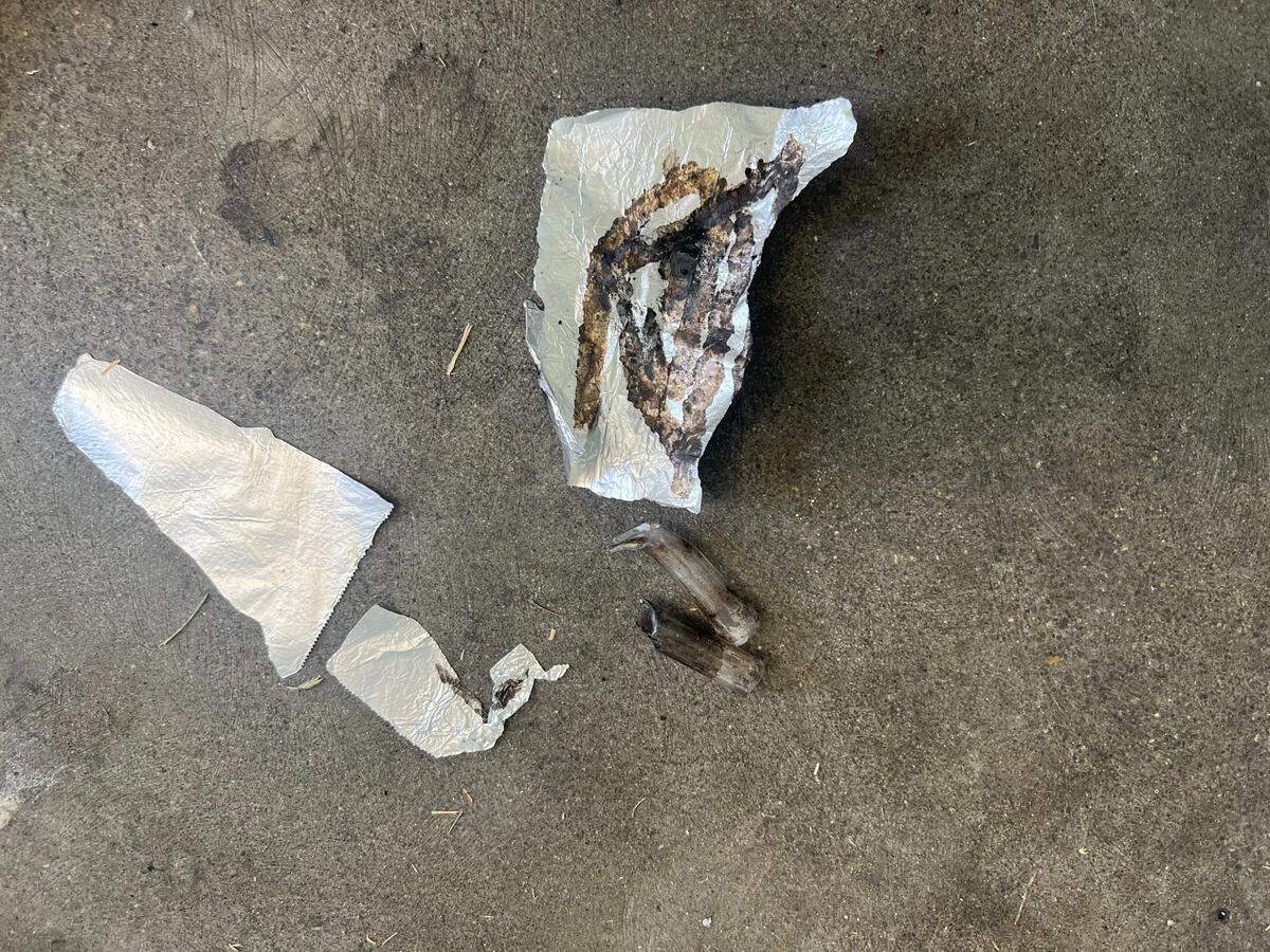 Discarded fentanyl foil and paraphernalia was left in a utility room that had been broken into.