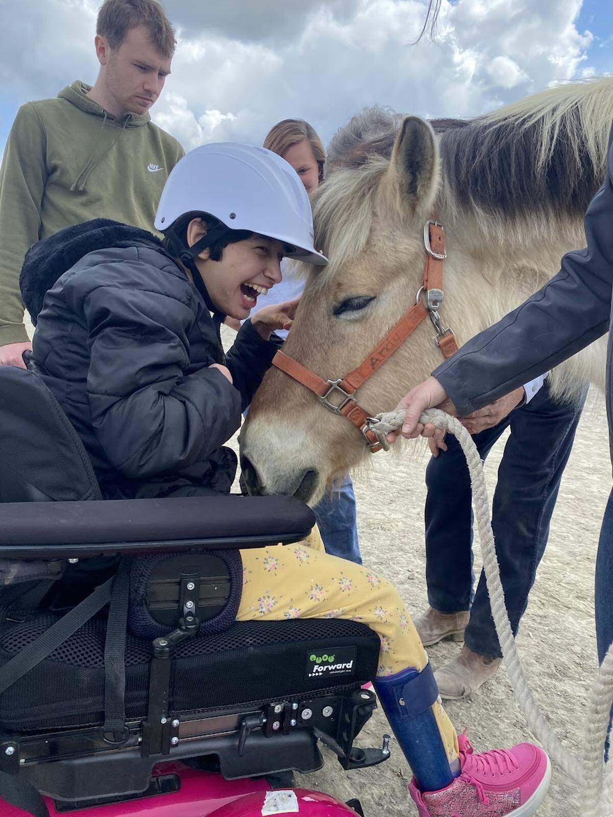 A rider participates in a Therapeutic Riding of Tri-Cities (TROT) program.